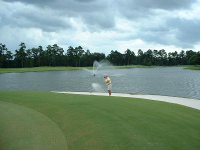 Dad's approach landed in the bunker.  He blasted out safely from here.