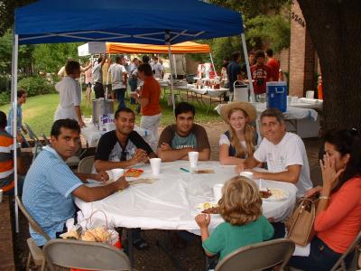 After our first guests from China and India left, 3 young gentlemen from India joined the table.  Grace took a brief break from serving to joined us for the photo.